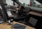Unbranded car dashboard and engineering bench showing built-in infotainment reliability testing