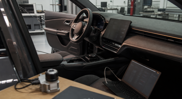 Unbranded car dashboard and engineering bench showing built-in infotainment reliability testing Unbranded car dashboard and engineering bench showing built-in infotainment reliability testing