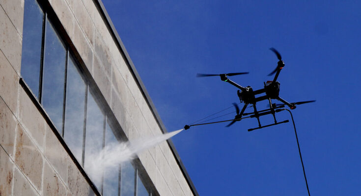 ABZ Innovation cleaning drone operating near a building facade