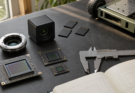 Unbranded camera sensor modules and field documentation gear on an engineering workbench