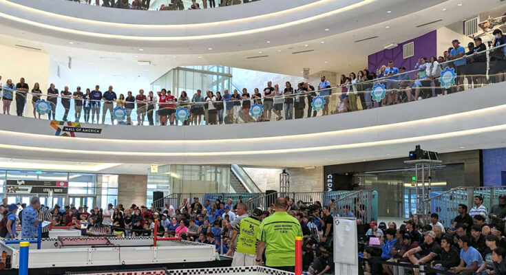 Official RECF robotics competition event photo showing teams, fields, and spectators Official RECF robotics competition event photo showing teams, fields, and spectators