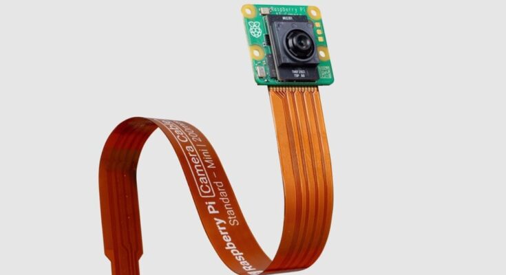 Official Raspberry Pi AI Camera product photo showing the camera module and ribbon connector Official Raspberry Pi AI Camera product photo showing the camera module and ribbon connector