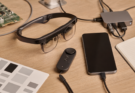 Developer workbench with lightweight XR glasses, phone, controller, and calibration notes