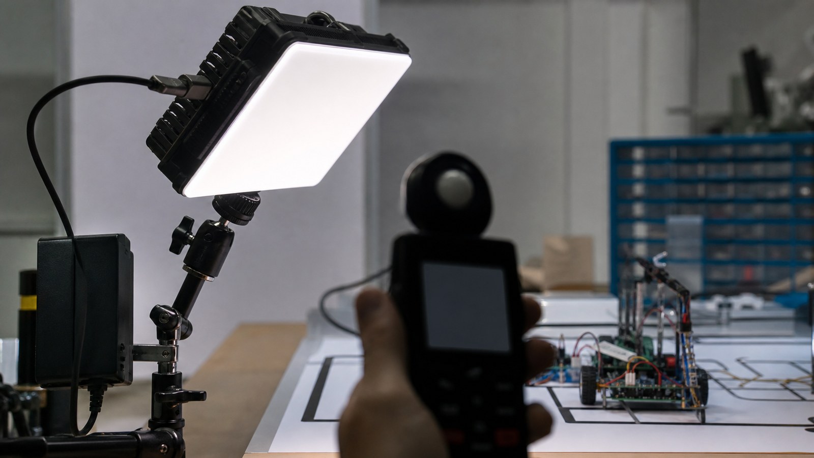 Portable LED panel and diffuser aimed at a robotics test area