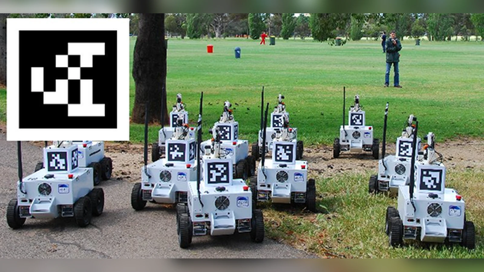 Robots and upright AprilTag targets in an outdoor vision setup