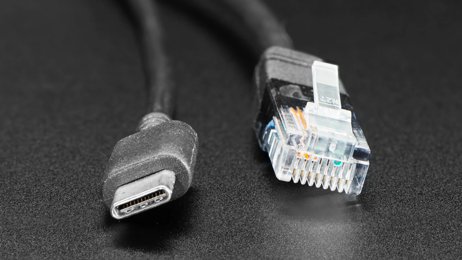 Close view of USB-C and RJ45 connectors from a PoE splitter