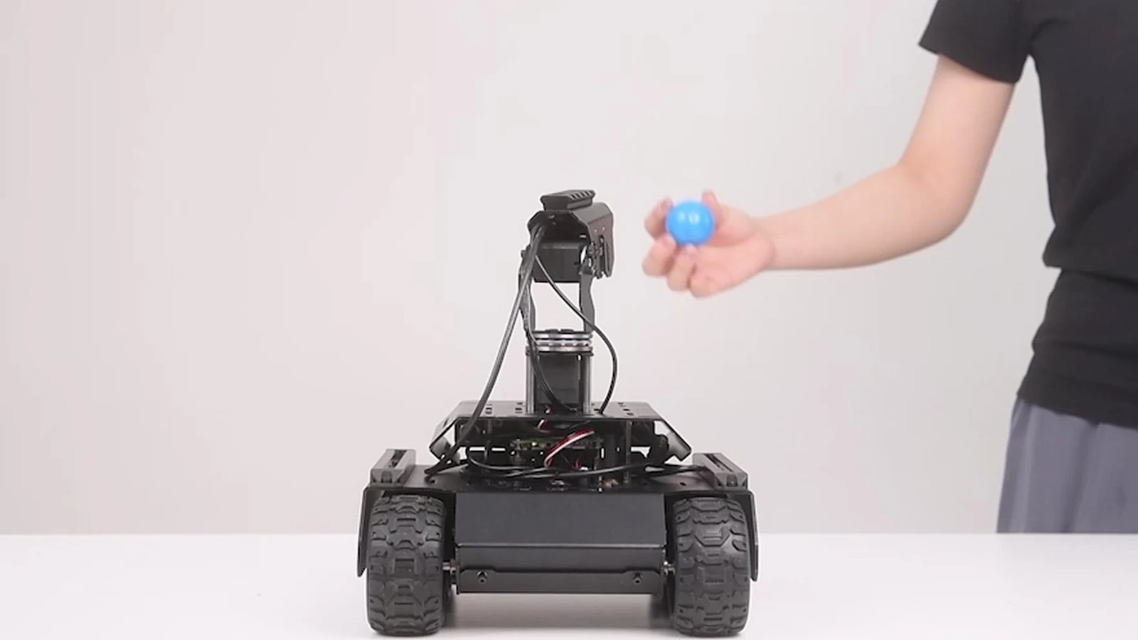 Waveshare rover in an object-tracking demonstration with a blue ball