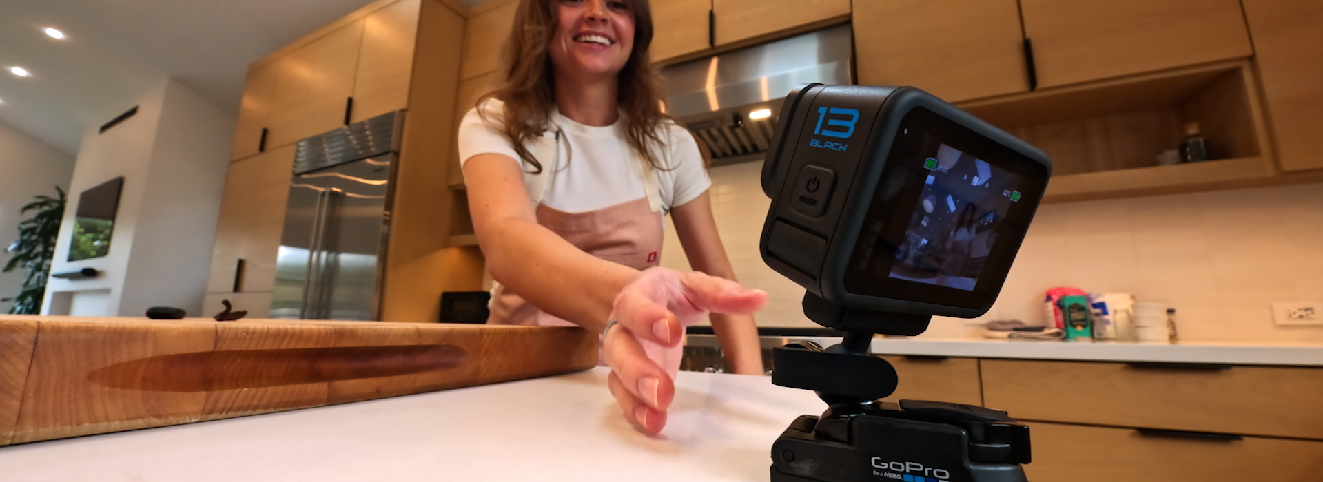 GoPro HERO13 Black on an official magnetic mounting system in an indoor scene