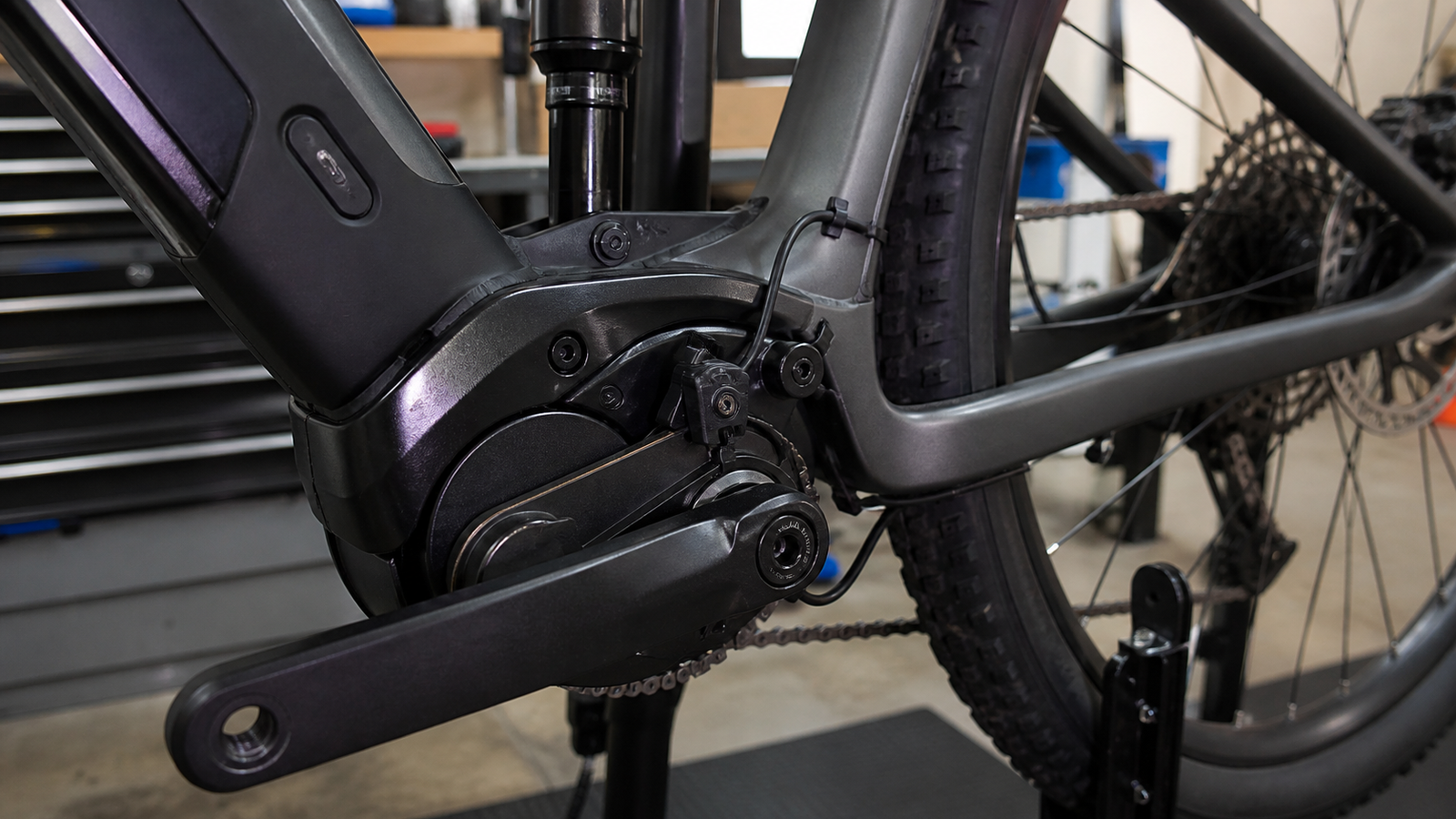 E-bike crank area with cadence sensor ring and wire routed cleanly on a supported bike