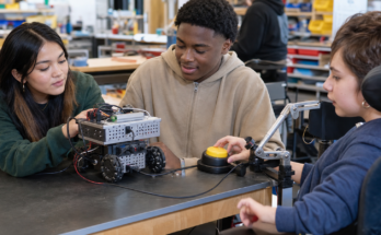 Classroom robotics table with adaptive accessibility switch and tabletop robot