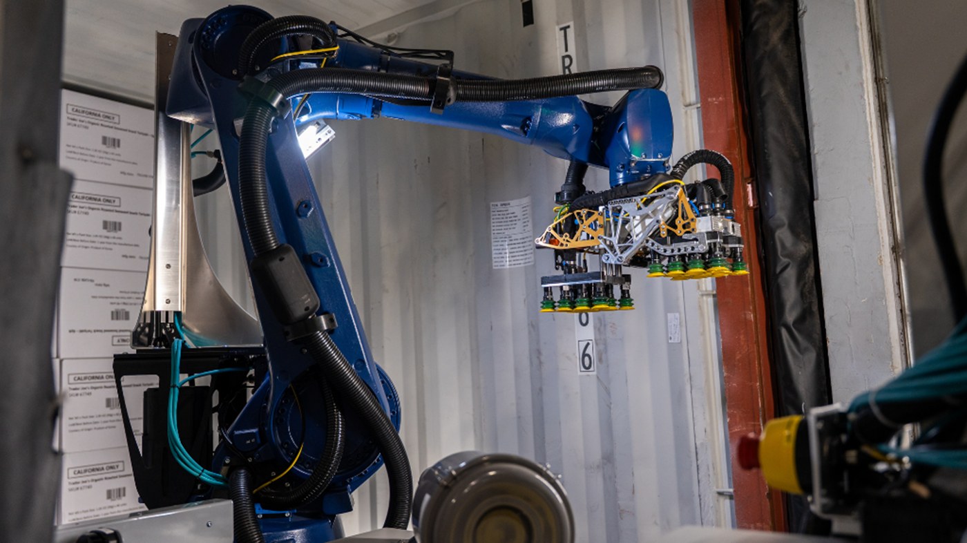 KUKA Contoro robot working inside a truck trailer unloading cartons