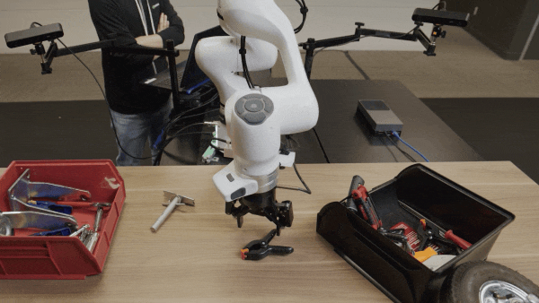 NVIDIA demonstration of robot arms manipulating tools with a Cosmos 3 Edge policy