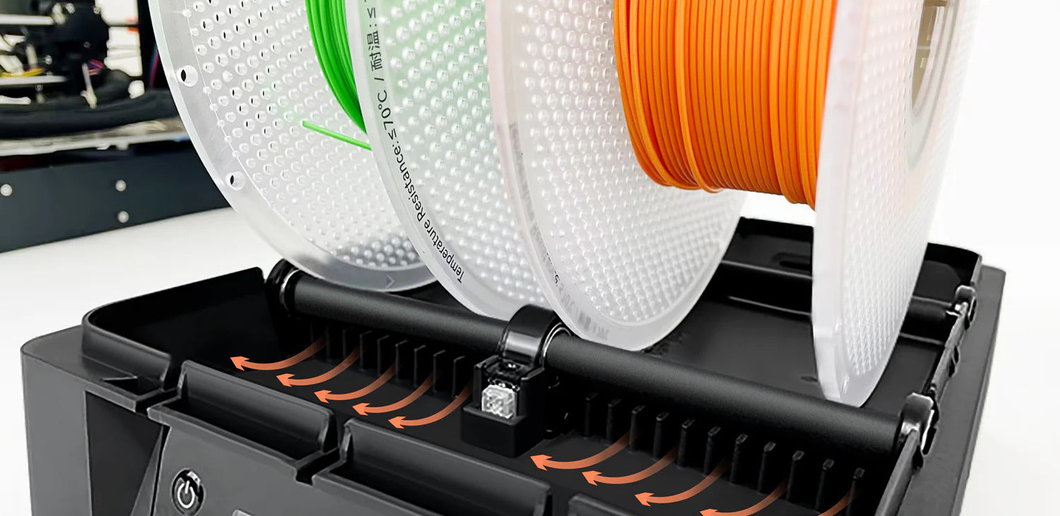 Close-up of two filament spools above the Polyphemus base, with manufacturer arrows marking distributed hot-air outlets.