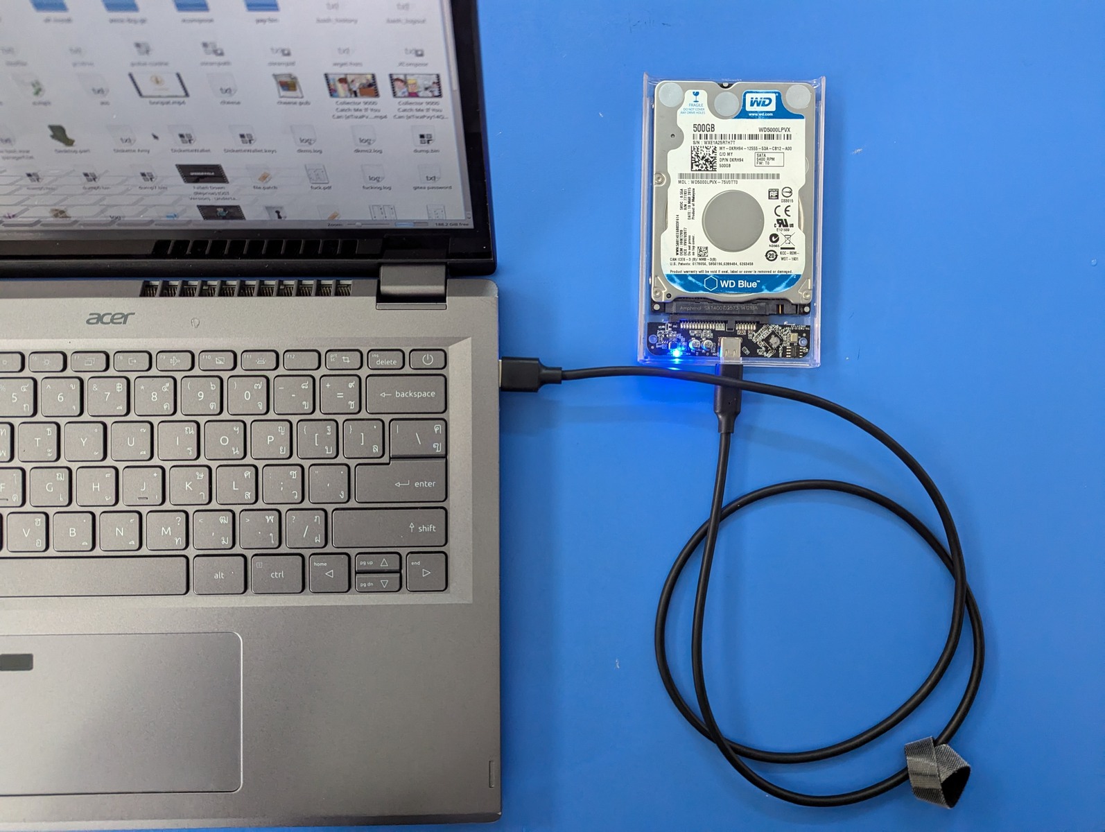 External hard drive connected to a laptop by USB