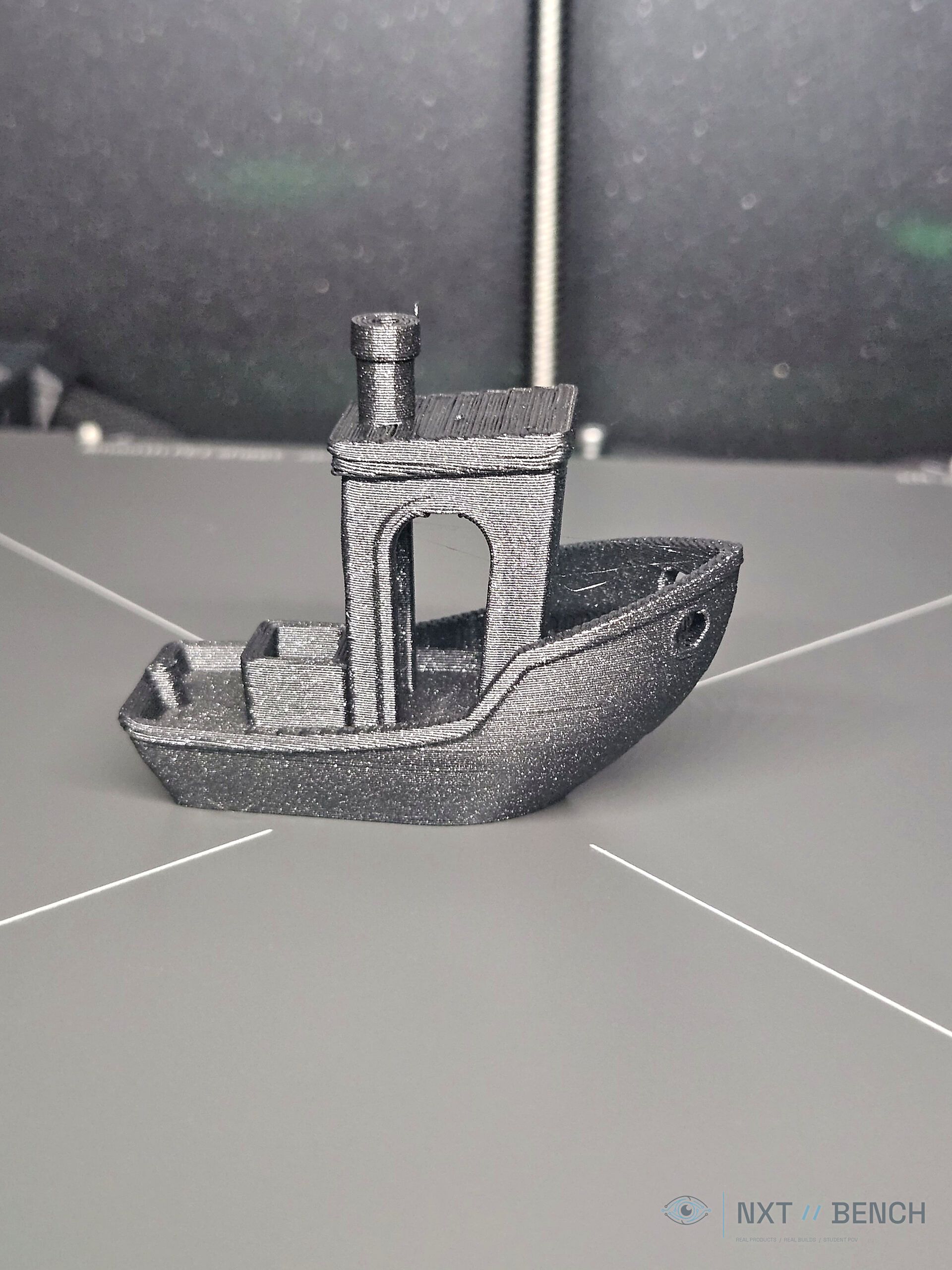 Close-up of the first 3D Benchy printed on the Prusa CORE One+.