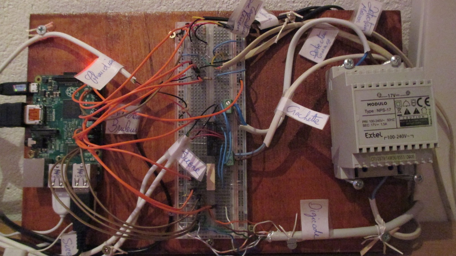 Real home-automation control electronics mounted in a lab cabinet.