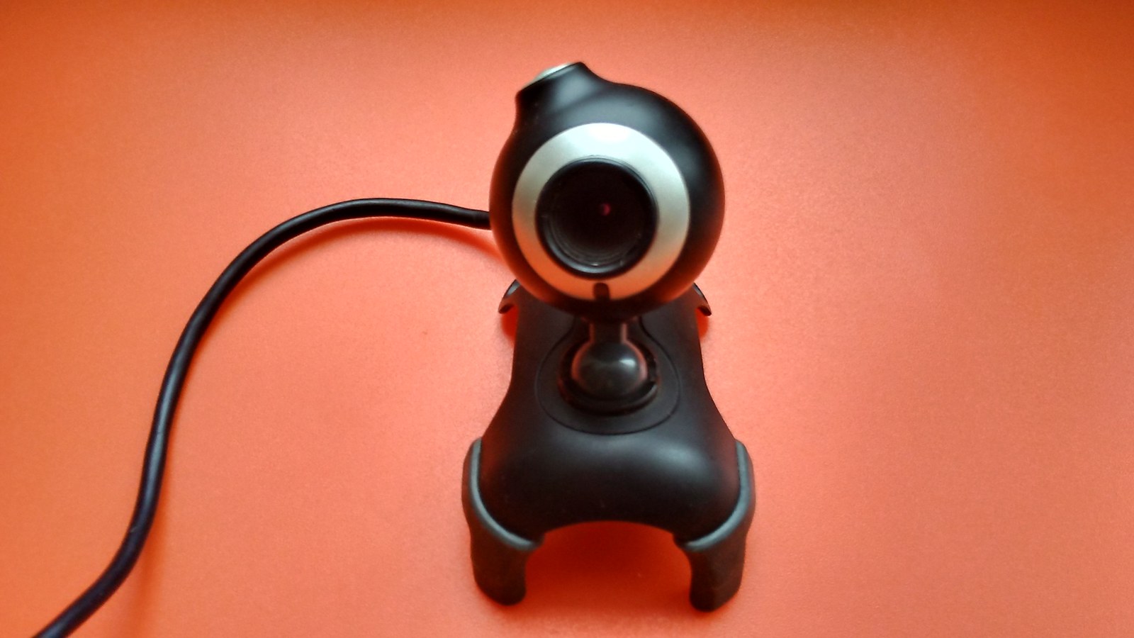 External USB webcam photographed against a neutral background.