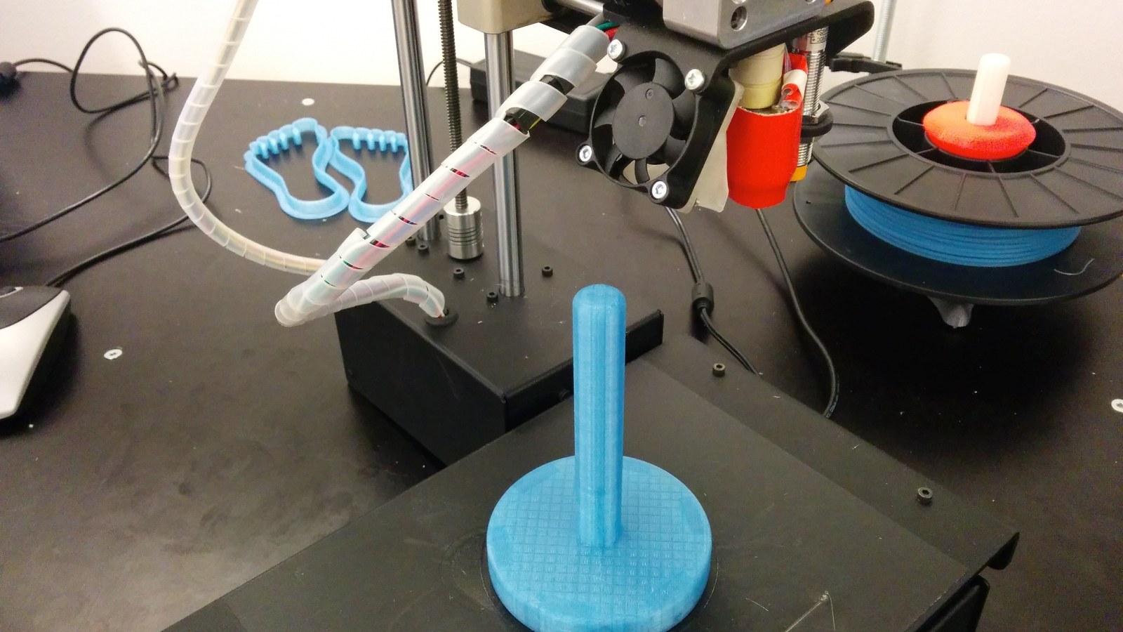 Desktop 3D printer producing a spool holder Desktop 3D printer producing a spool holder