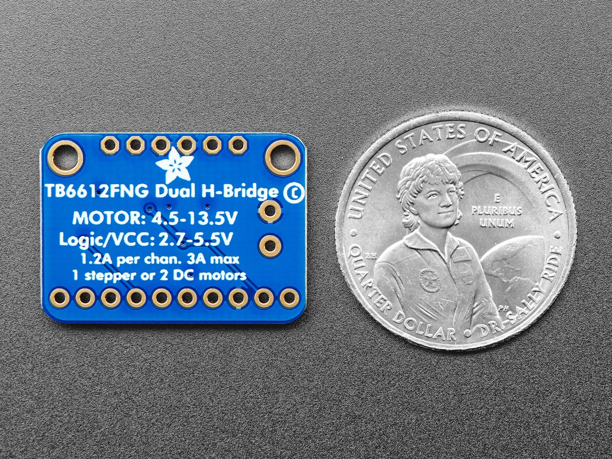 Back of a TB6612FNG breakout beside a coin, with motor voltage and current ratings visible