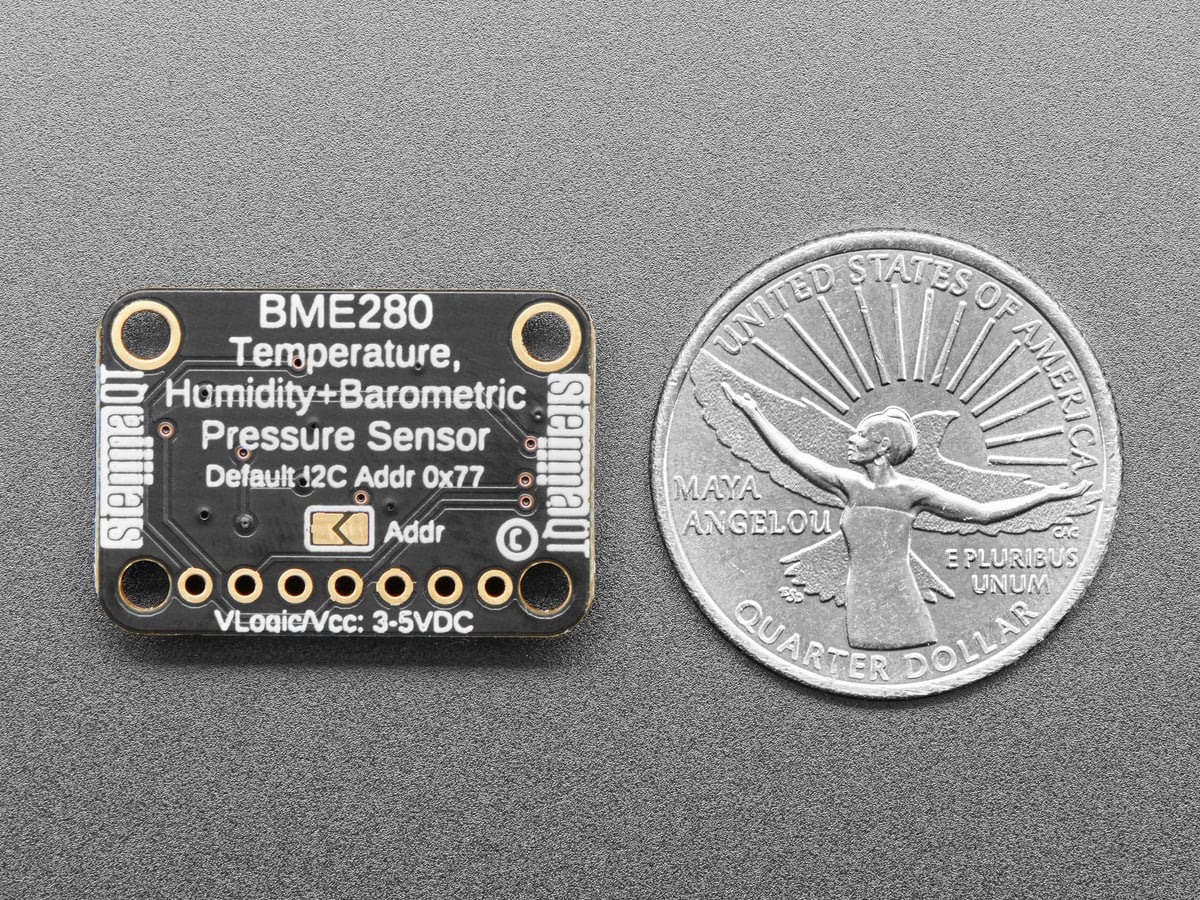 Back of an Adafruit BME280 breakout beside a coin