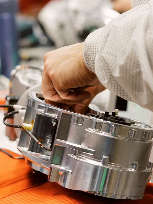 Engineer adjusting a robotic component at Agility Robotics