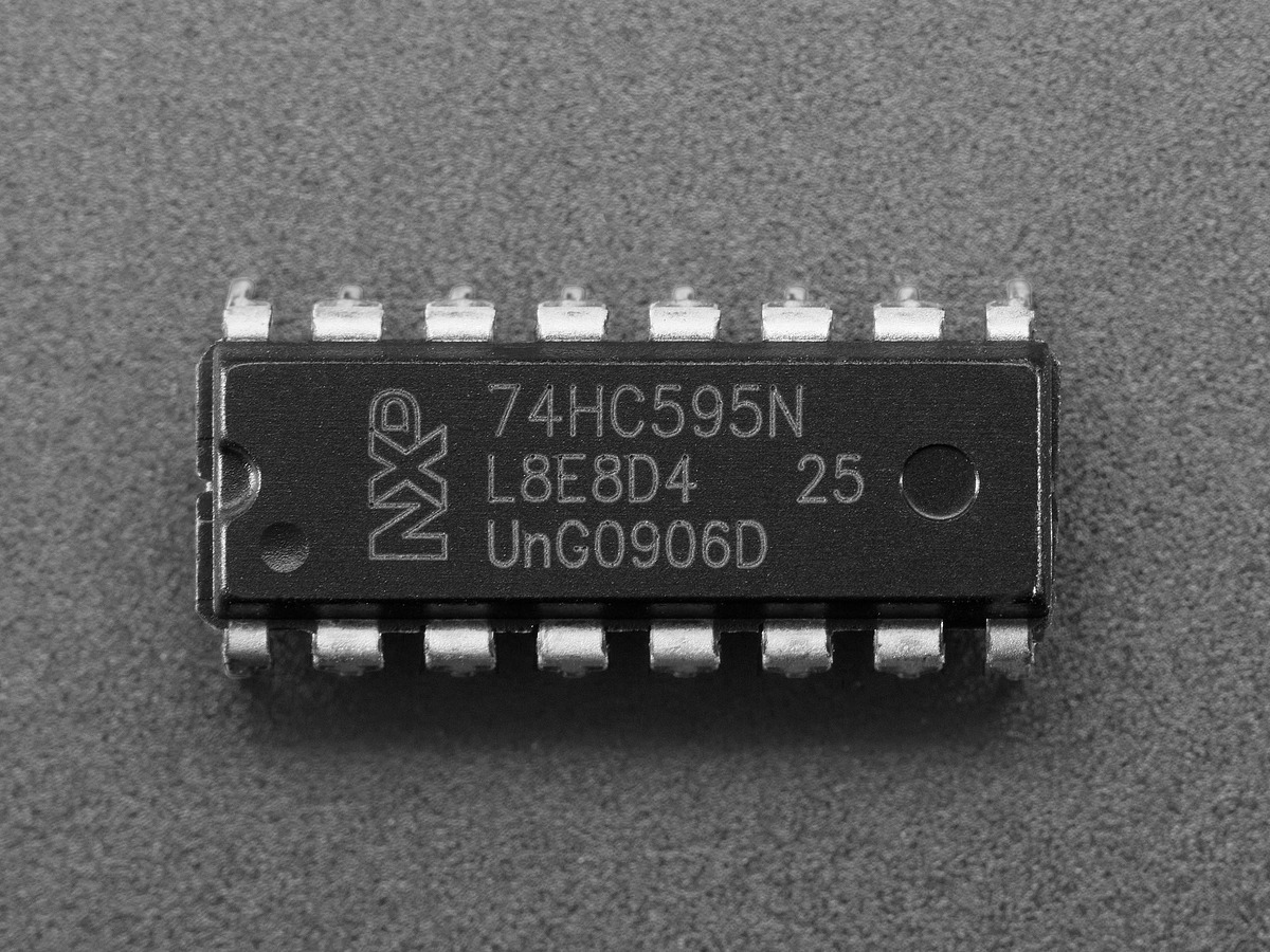 Close-up photograph of a 74HC595N DIP package