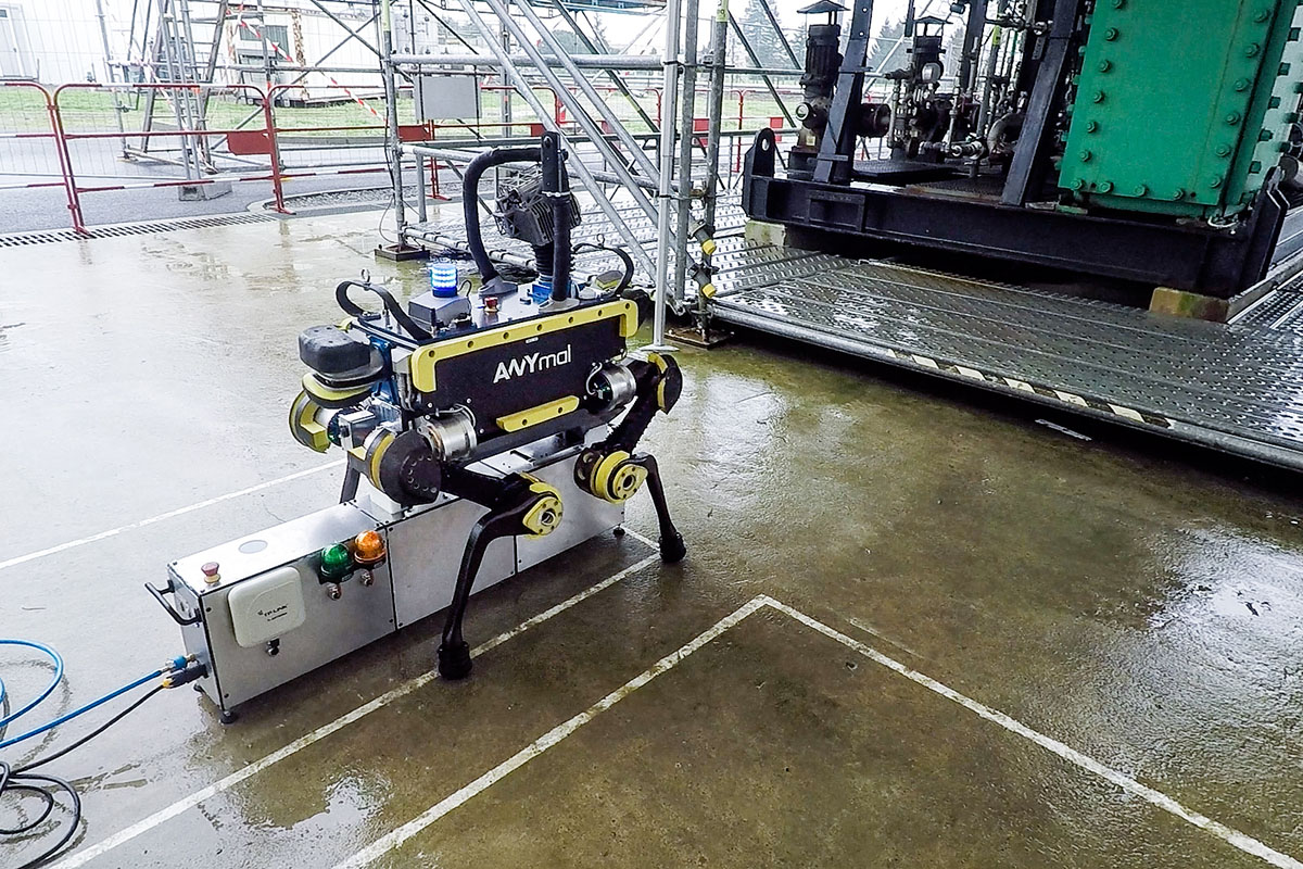 ANYmal robot beside industrial equipment and an inspection support unit