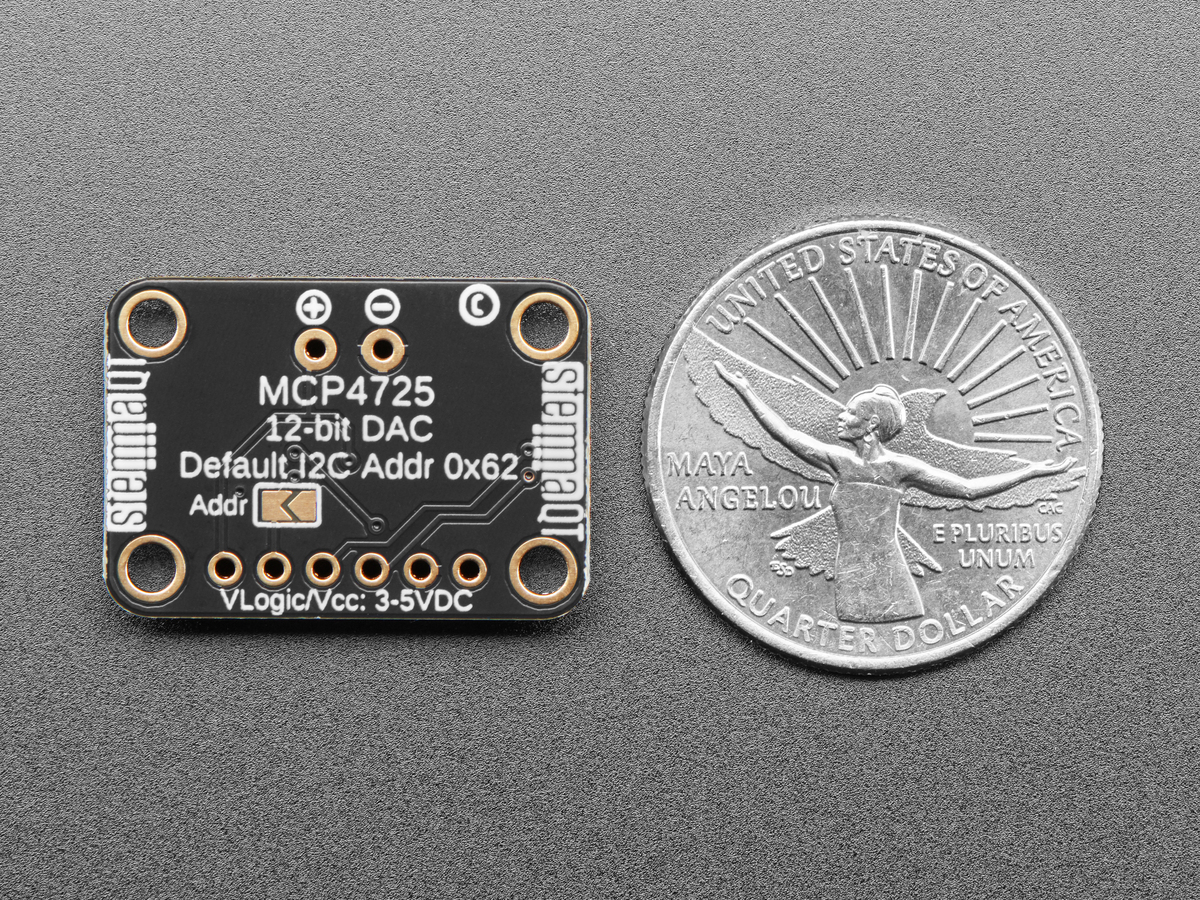 Back of MCP4725 breakout beside a US quarter for scale