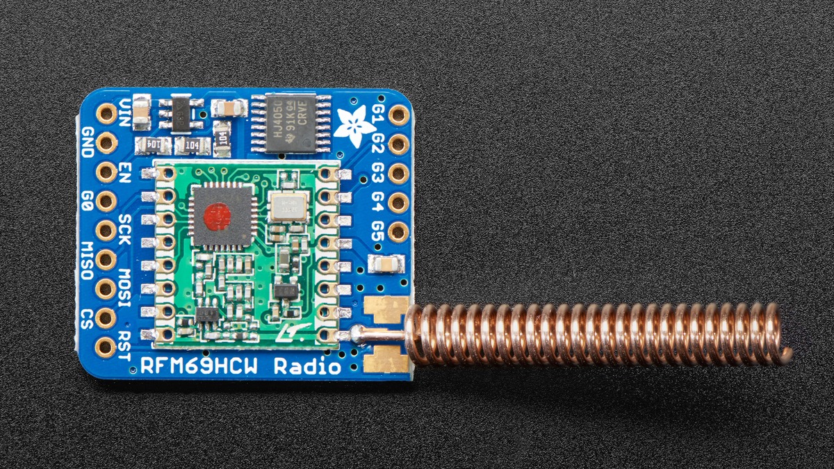 Adafruit RFM69HCW breakout connected to a compact spring antenna