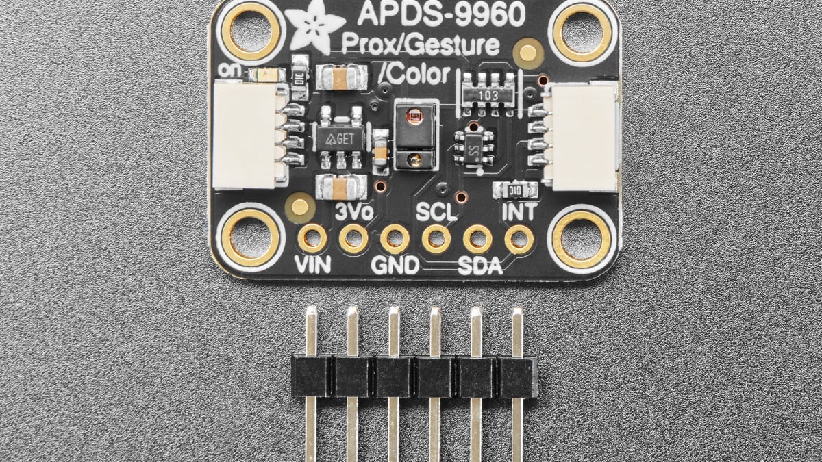 Top view of the Adafruit APDS9960 breakout with the optical sensor visible