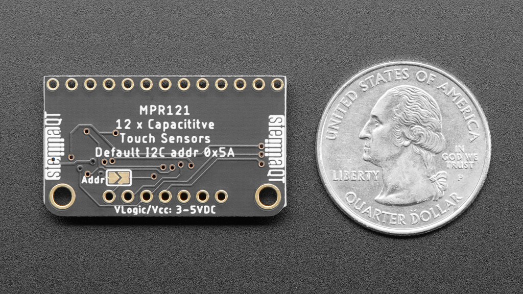 Back view of the Adafruit MPR121 breakout showing address and connector pads